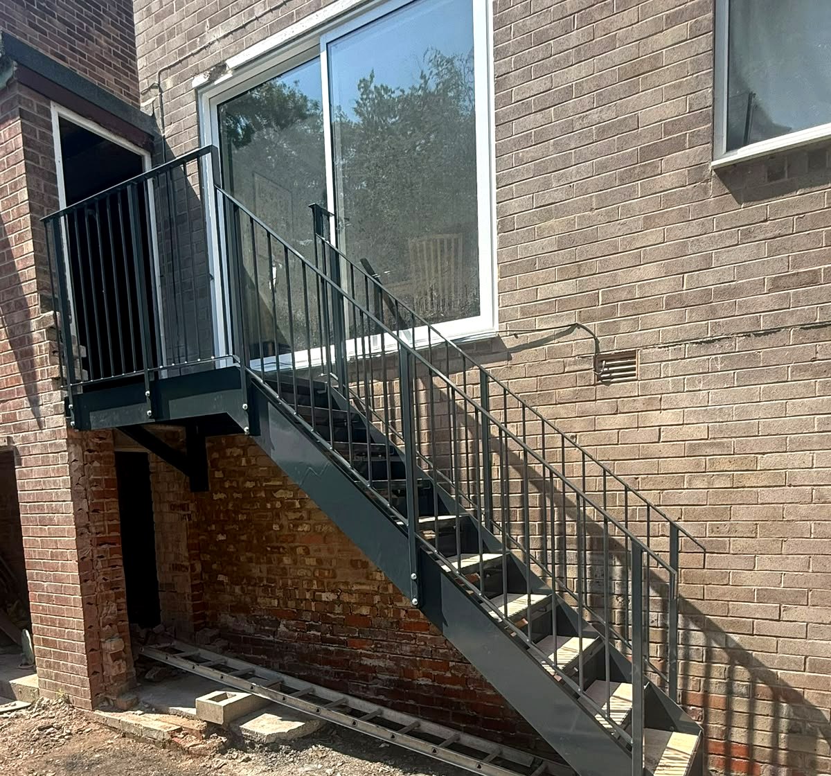 New anthracite grey external steel staircase with square-bar balustrade, Meadowhead, Sheffield